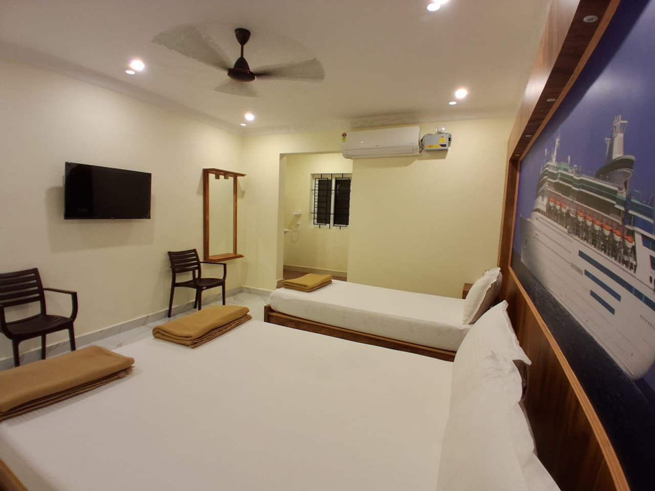 Deluxe Triple Room TV and AC view