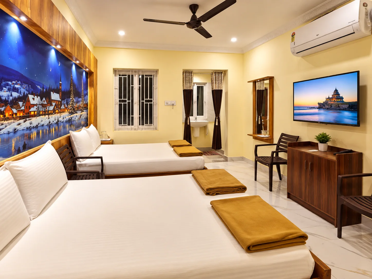 Family room with beds, AC and wall-mounted TV