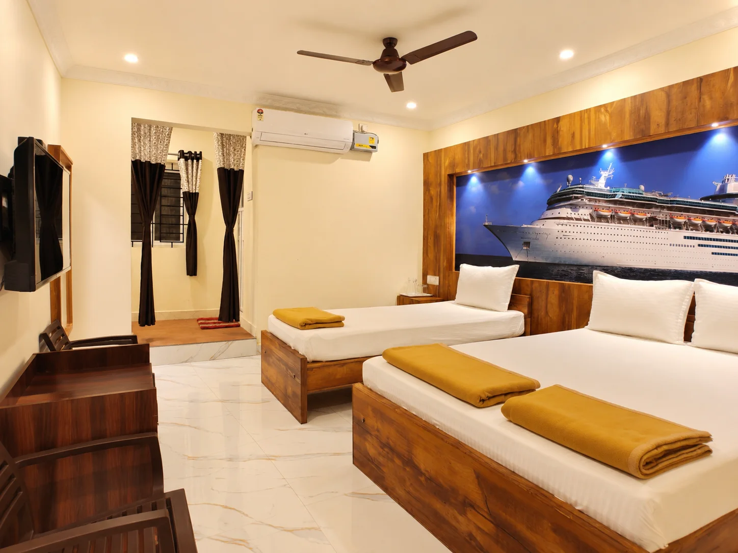 Triple room with cruise ship mural, double and single beds